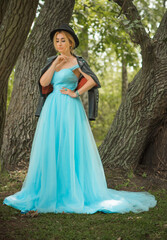 Fototapeta premium Elegant European bride in turquoise dress, fancy bridal collection, dress for wedding