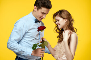 man and woman flower romance relationship yellow background