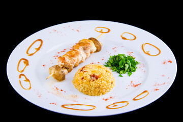 Chicken skewer: Chicken fillet, bell pepper, mushrooms, spicy couscous with vegetables and dried tomatoes with parsley