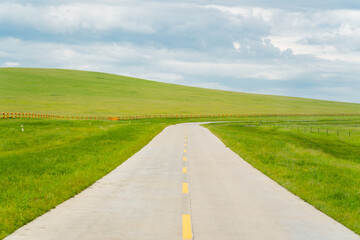 Fototapeta premium A highway road on Hulunbuir Grasslands, China, summer time.