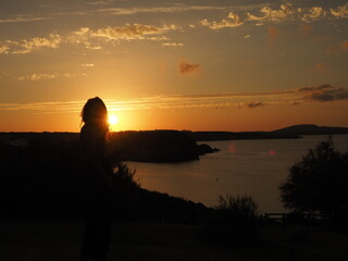 silhouette of a young woman in Menorca 