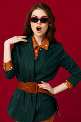 woman with open mouth wearing sunglasses blazer fashion cropped view