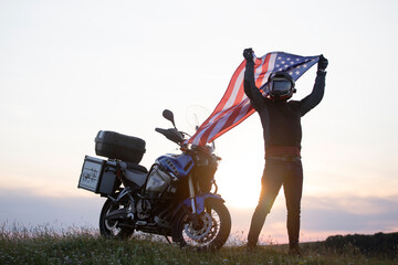  Patriot man holding the american flag on the 4th of July - Powered by Adobe