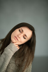 Portrait of a girl with dark hair and brown eyes
Nice girl long dark thick hair big brown eyes natural makeup in a sweater