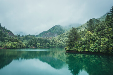 Lake in misty mountains