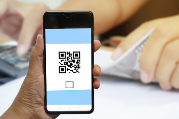 Concept of scanning a mobile QR CODE on a mobile phone.