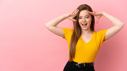 Fototapeta na wymiar Teenager girl over isolated pink background with surprise expression