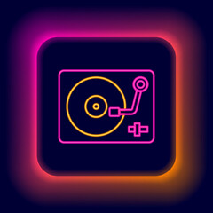 Glowing neon line Vinyl player with a vinyl disk icon isolated on black background. Colorful outline concept. Vector