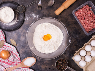 Ingredients for maet pies or dumplings on a metal tray