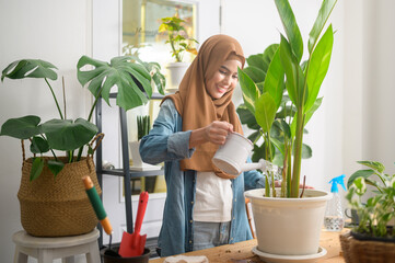 Happy young muslim woman enjoying  and relaxing leisure activity in garden at home