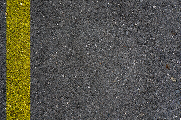 Fototapeta premium Street and yellow line on the asphalt texture background. 