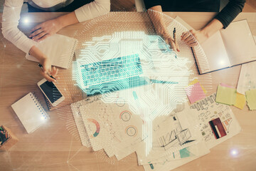 Double exposure of woman working on computer andhuman brain hologram drawing. Top View. Ai concept.