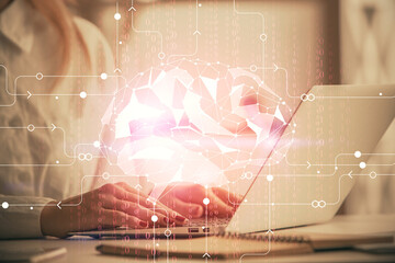 Multi exposure of woman hands working on computer and human brain hologram drawing. Ai tech concept.