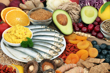 Fototapeta na wymiar Healthy food for fitness & vitality concept high in antioxidants, protein, omega 3, vitamins, minerals, anthocyanins & fibre. Seafood, vegetables, fruit, cereals, seeds, grains & supplement powders.