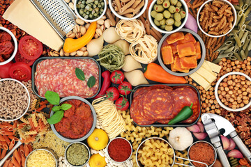 Large collection of Italian and Mediterranean food ingredients for a healthy diet high in antioxidants, anthocyanins, dietary fibre, lycopene, omega 3 and protein. Health food concept. Flat lay.