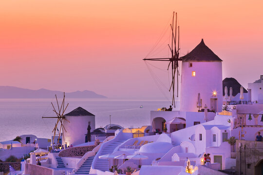 Beautiful sunset in famous romantic village Oia Santorini, Greece.