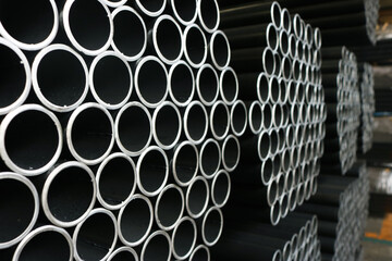 Steel round pipe packaging background. - obrazy, fototapety, plakaty