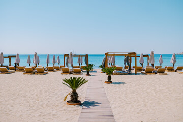 Paralia Platis Gialos beach Mykonos, Petinos beach Mikonos island Greece, luxury beach bed chairs,...