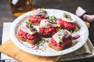 herring appetizer. Herring with beets on rye bread. Brain food concept. Home cooking
