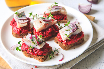 herring appetizer. Herring with beets on rye bread. Brain food concept. Home cooking