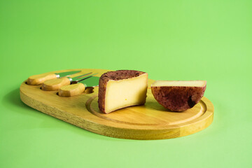 berry cheese suluguni with mint on on wooden board