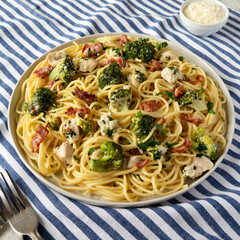 Homemade Chicken Bacon Broccoli Alfredo on a plate, low angle view.