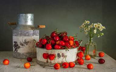 Still life with ripe berries and fragrant wildflowers.