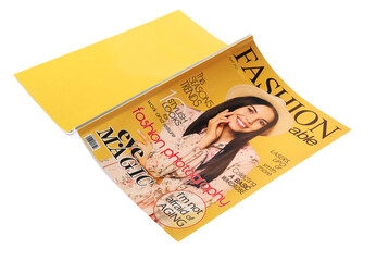 Modern printed fashion magazine isolated on white