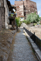 Fototapeta na wymiar Narrow walking path around Ankara Castle and view of the castle tower