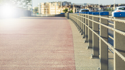 The running track is fenced off from the carriageway