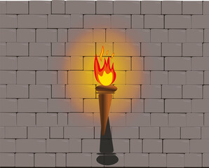 flaming torch throwing glow of light on castle wall