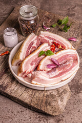 Raw pork belly with rind, peritoneum meat, spices and herbs