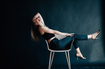 Hilarious business woman laughs in chair
