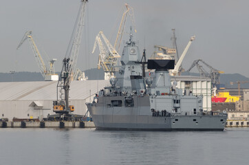WARSHIP - Guided missile frigate flows to the port