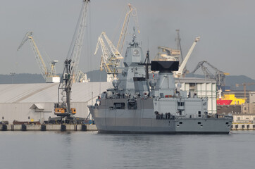 Fototapeta premium WARSHIP - Guided missile frigate flows to the port