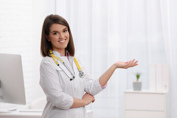 Portrait of pediatrician with stethoscope in clinic