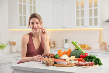 Woman with healthy food in kitchen. Keto diet