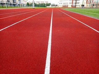 Running track at the stadium. Sports, sports competitions, football stadium, school