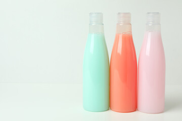 Blank bottles of shampoo on white background
