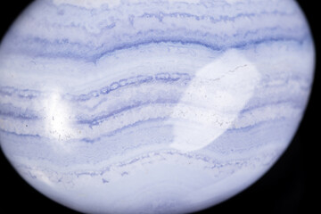 Macro mineral stone blue agate on black background