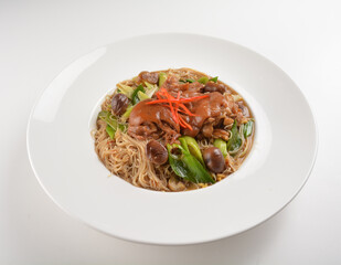 chinese braised dry bee hoon bee noodle with pork trotter leg and vegetables in plate on white table asian cafe restaurant halal menu