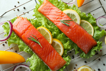 Concept of cooking salmon on white textured background