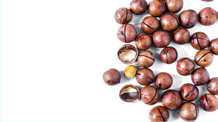 a scattering of sweet macadamia nuts on a white background kopi space macadamia nut	