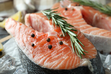 Fresh raw salmon and ingredients for cooking, close up