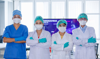 Group row of female researchers team wearing hygiene face mask crossed arms and looking at camera. Concept for hard work of scientists in Covid-19 outbreak