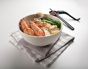 big tiger prawn seafood Lala with bee hoon noodle mee soup hot asian menu in bowl 