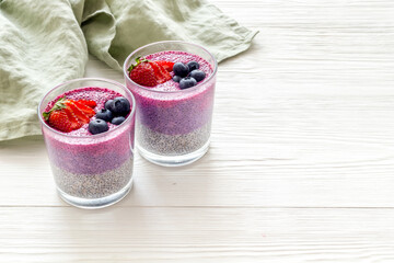Homemade yogurt chia seeds pudding with strawberries in glasses