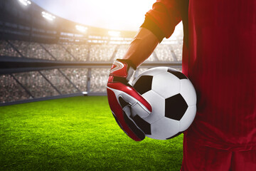 Goalkeeper holding a soccer ball