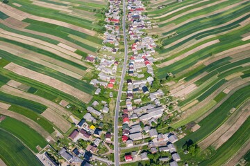 Village from drone. Suloszowa village in Krakow County, Lesser Poland Voivodeship, in southern Poland. Beautiful village with houses and fields in Poland.