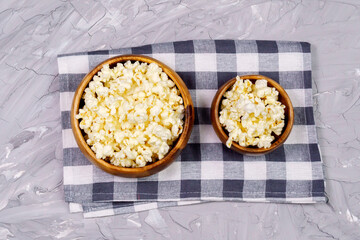 Popcorn on gray cement background. Cinema concept image. loft wall background. Watch movies online.